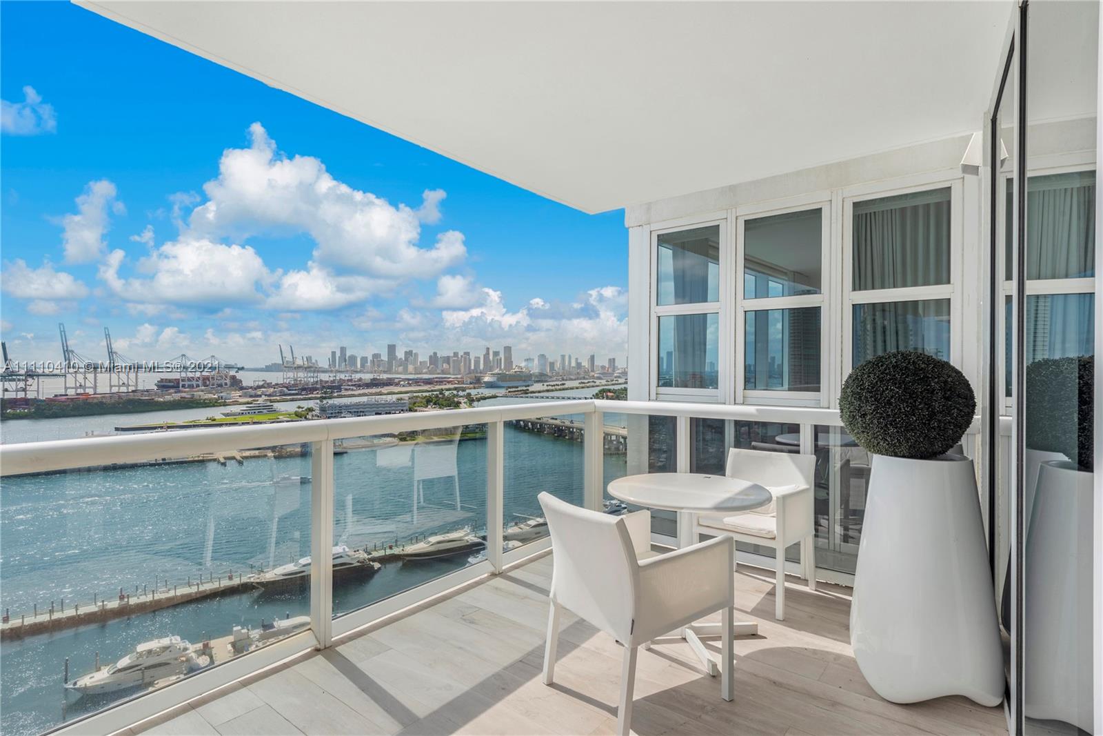 400 Alton Road, Unit 2003 Miami Beach, FL 33139 - Photo 31 of 38 a view of a chairs and table in a terrace