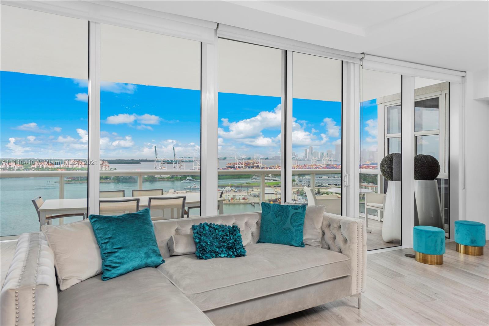 400 Alton Road, Unit 2003 Miami Beach, FL 33139 - Photo 6 of 38 a living room with furniture and a floor to ceiling window