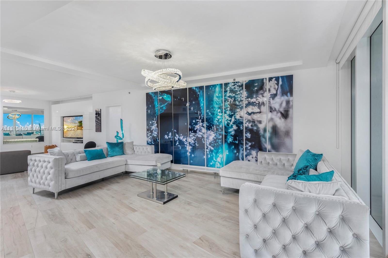 400 Alton Road, Unit 2003 Miami Beach, FL 33139 - Photo 8 of 38 a living room with furniture and a floor to ceiling window