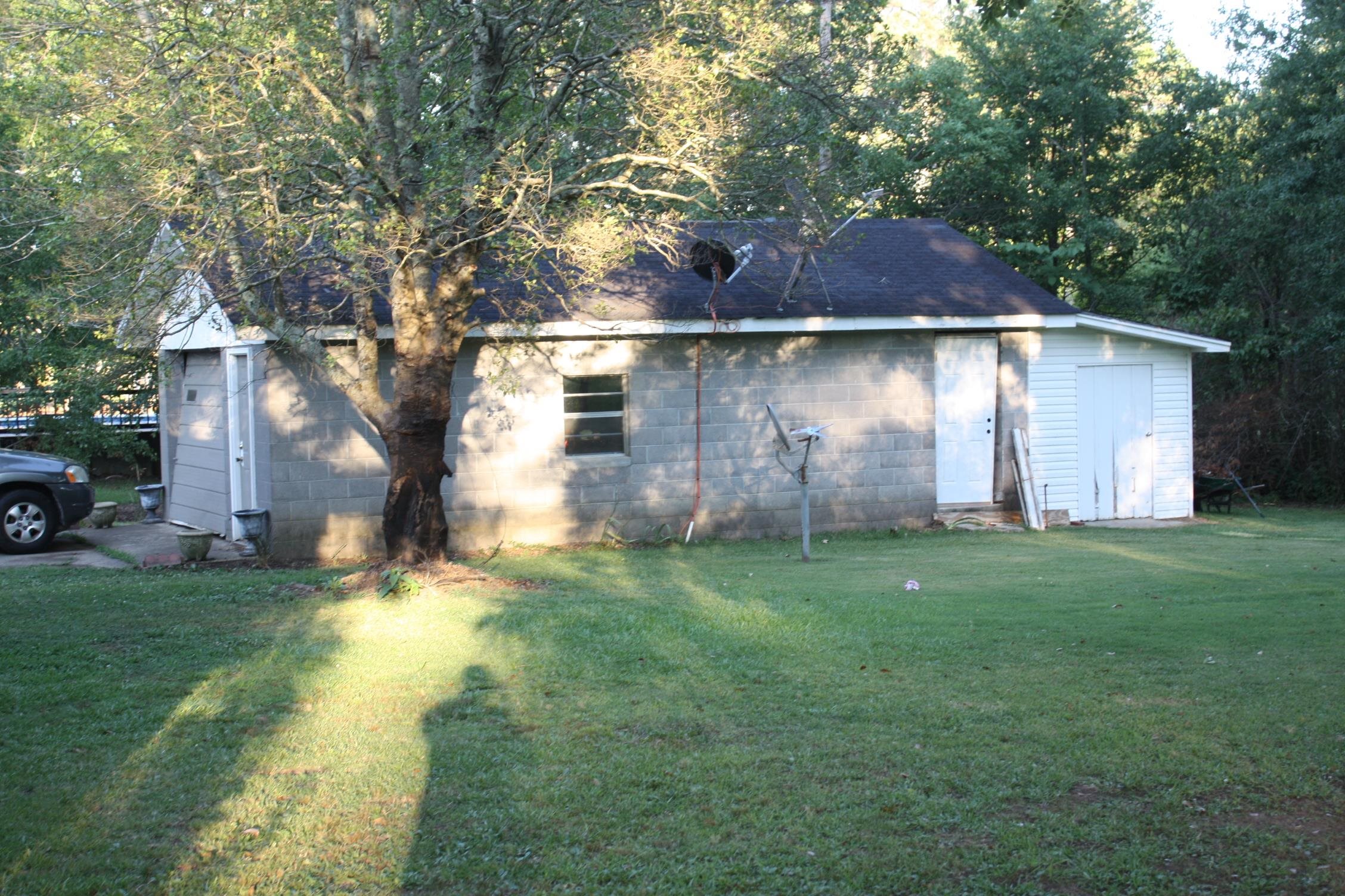 3200 57th Highway West Ramer, TN 38367 - Photo 8 of 24 a view of a yard in front of a house with large tree