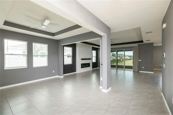 a kitchen with stainless steel appliances granite countertop wood cabinets and refrigerator