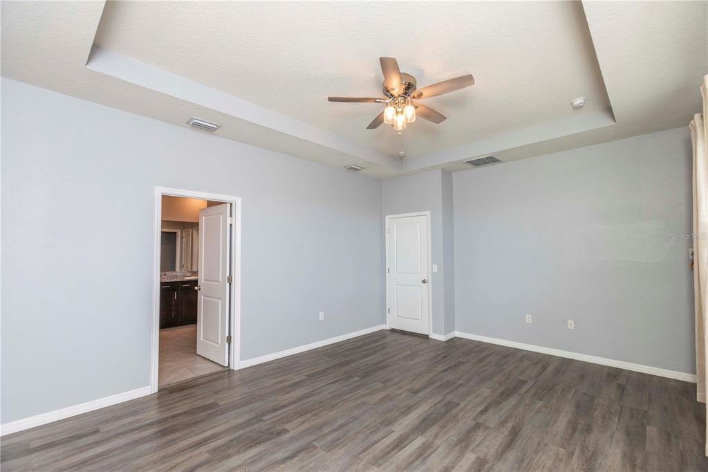 13483 Golden Lime Ave Spring Hill Spring Hill, FL 34609 - Photo 37 of 92 a view of an empty room with wooden floor