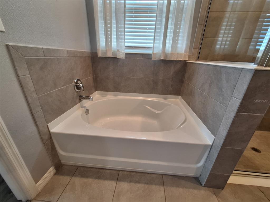 13483 Golden Lime Ave Spring Hill Spring Hill, FL 34609 - Photo 38 of 92 a bathroom with sink and window