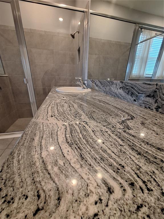 13483 Golden Lime Ave Spring Hill Spring Hill, FL 34609 - Photo 42 of 92 a bathroom with a sink and a mirror