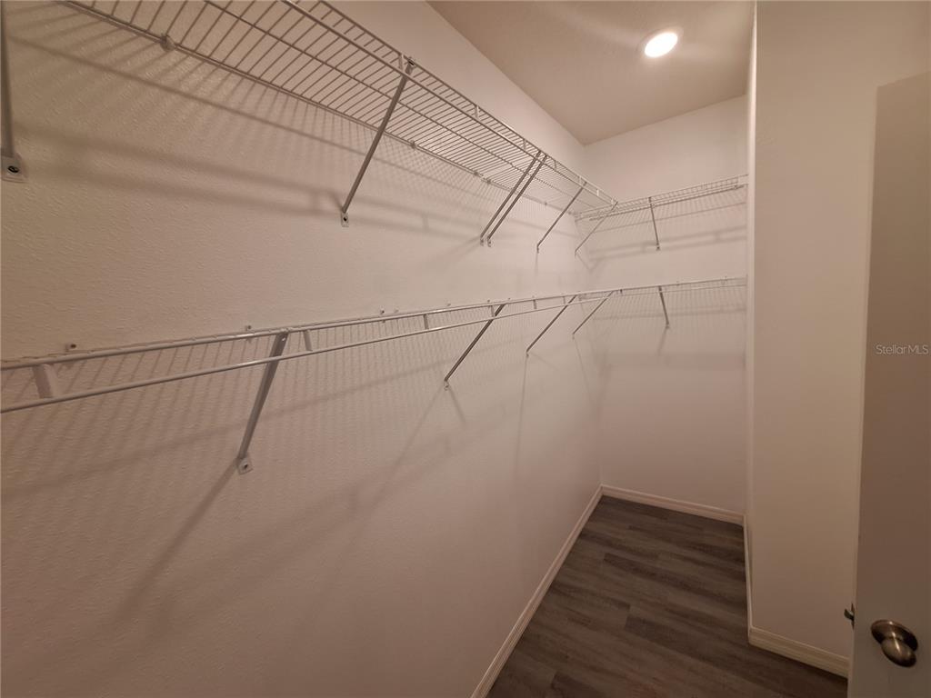 13483 Golden Lime Ave Spring Hill Spring Hill, FL 34609 - Photo 46 of 92 a view of a room with racks on the wall