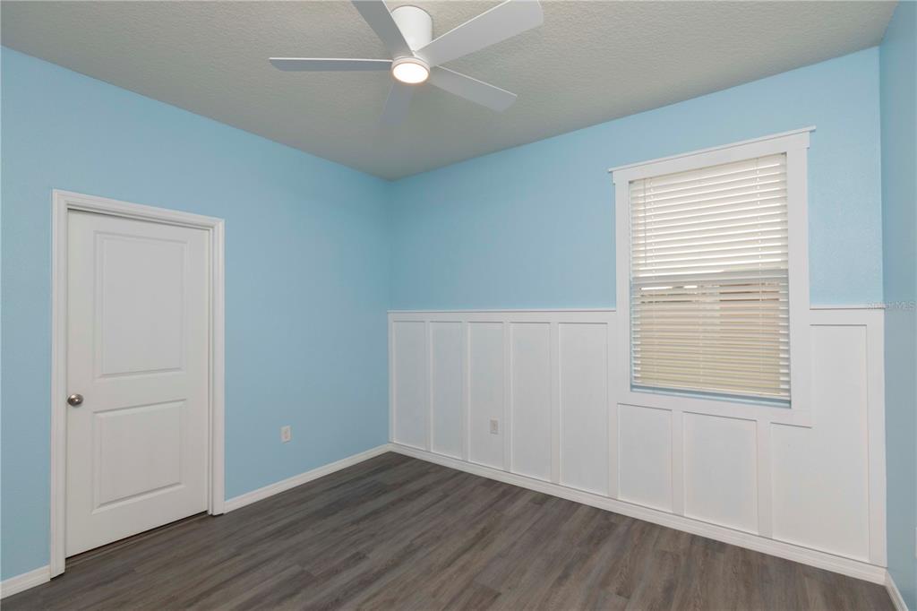 13483 Golden Lime Ave Spring Hill Spring Hill, FL 34609 - Photo 48 of 92 an empty room with wooden floor closet and windows