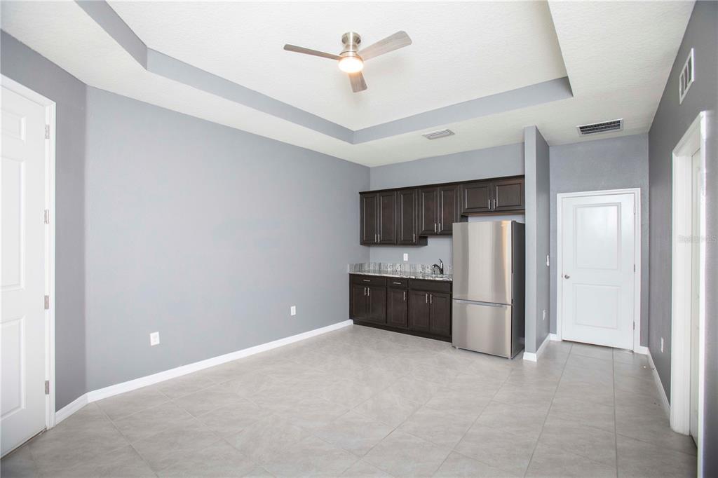 13483 Golden Lime Ave Spring Hill Spring Hill, FL 34609 - Photo 61 of 92 a kitchen with stainless steel appliances a refrigerator and a ceiling fan