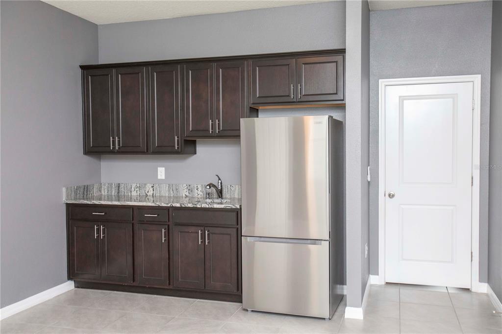 13483 Golden Lime Ave Spring Hill Spring Hill, FL 34609 - Photo 63 of 92 a white refrigerator freezer sitting in a kitchen