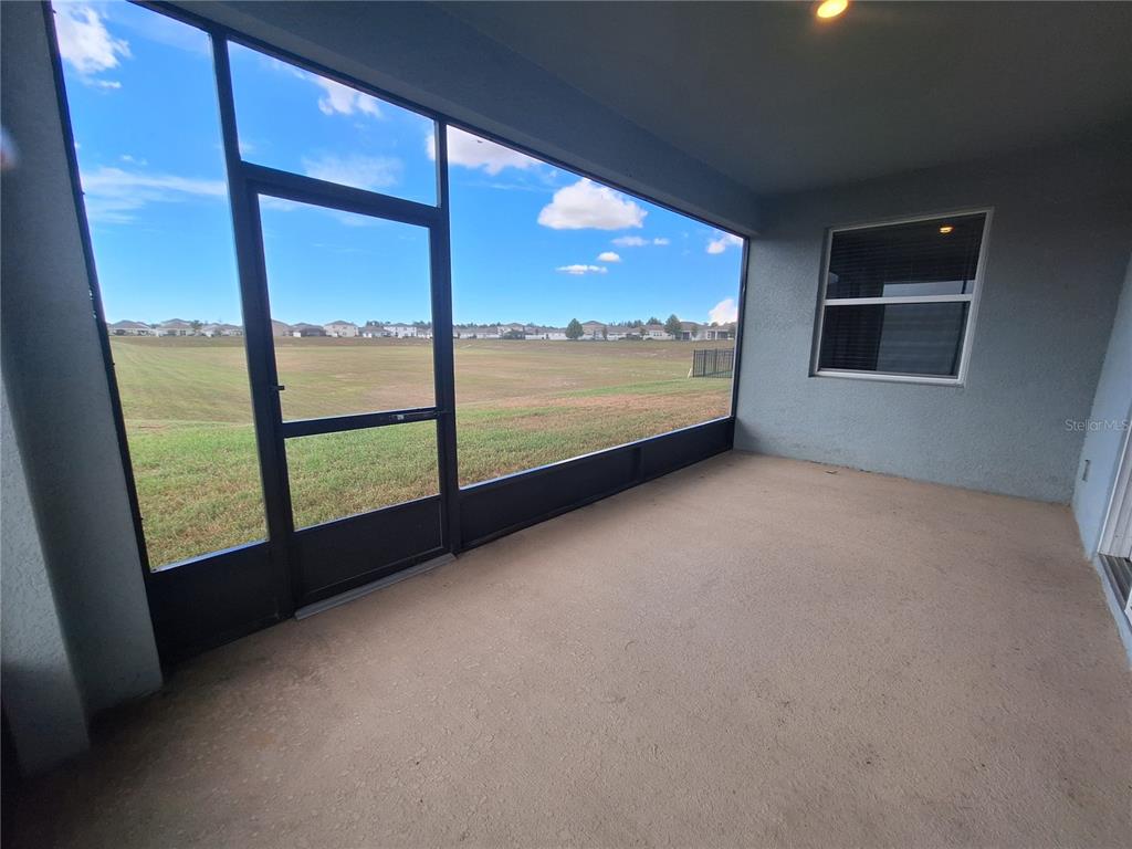 13483 Golden Lime Ave Spring Hill Spring Hill, FL 34609 - Photo 73 of 92 a view of an empty room with a large window