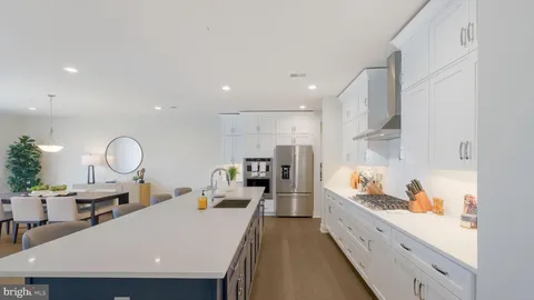 a large kitchen with lots of counter space and a sink