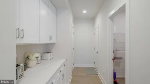 a room with a sink and cabinets