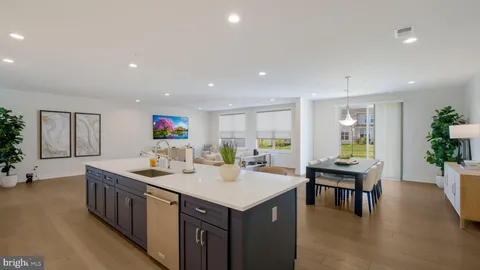 a kitchen with a counter top space and windows