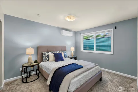 a bedroom with a bed and window