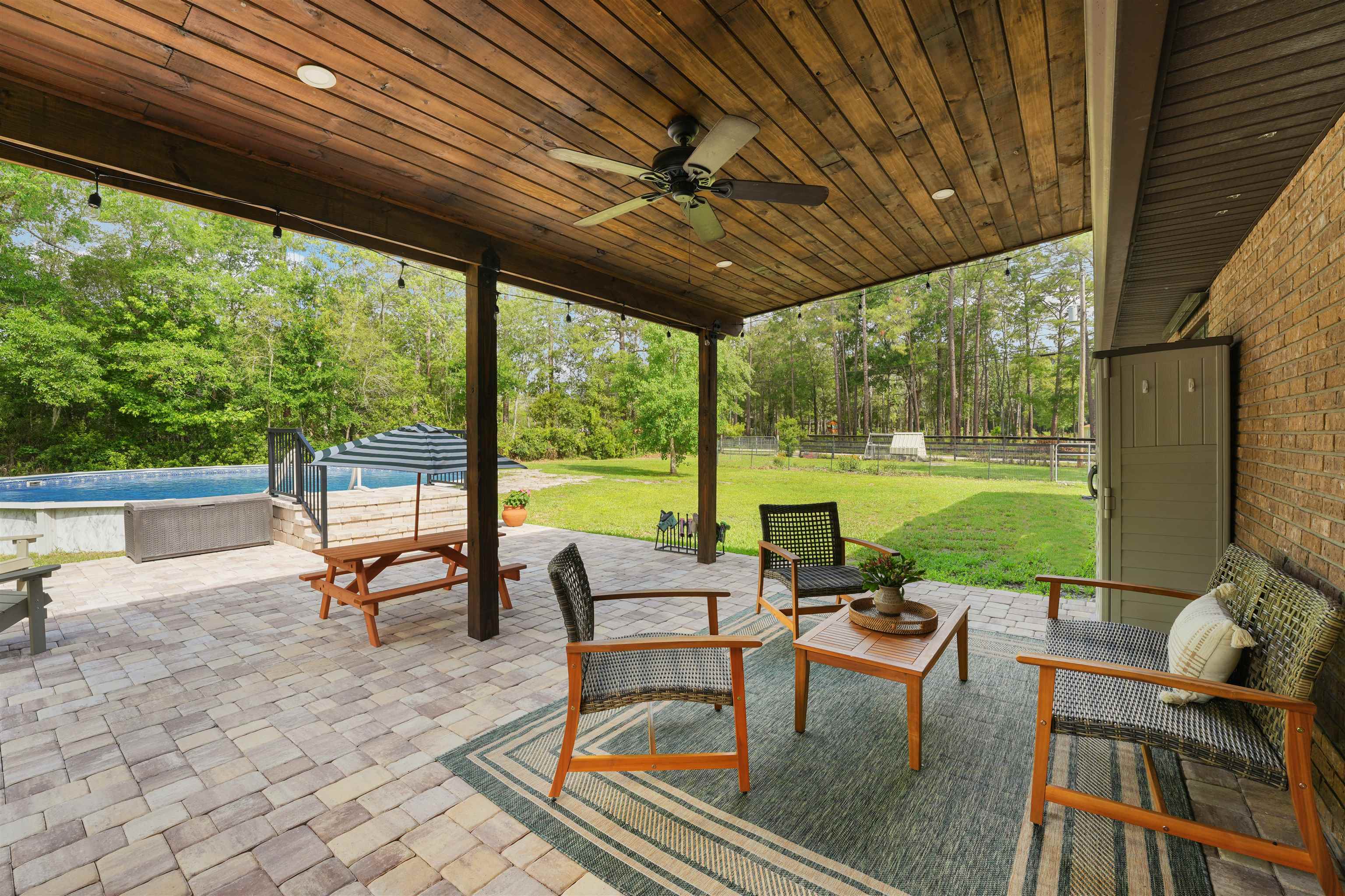 1805 Bennett Road St. Augustine, FL 32092 - Photo 37 of 65 a view of a patio with chairs and backyard