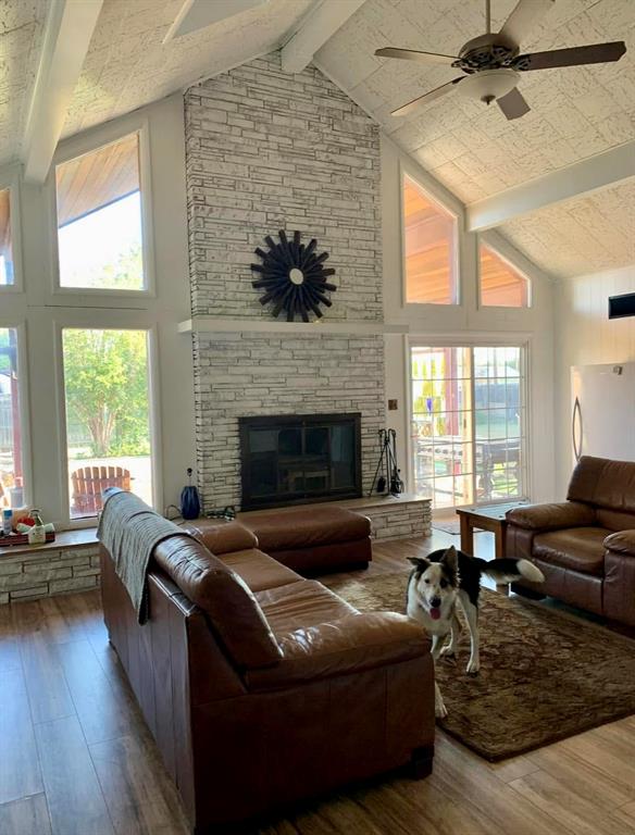600 Mercer Street Quanah, TX 79252 - Photo 11 of 28 a living room with furniture window and a fireplace