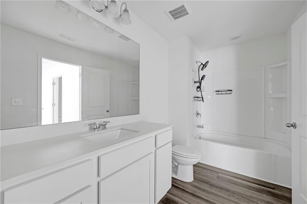3568 Eagle Court Atlanta, GA 30331 - Photo 13 of 19 a bathroom with a sink a toilet and shower