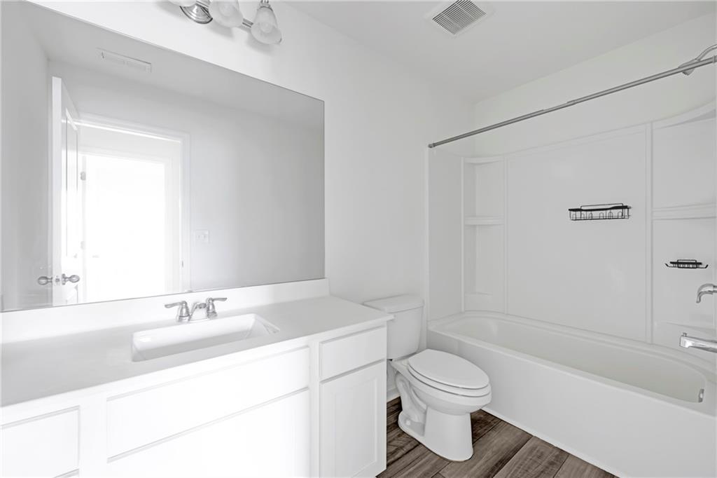 3568 Eagle Court Atlanta, GA 30331 - Photo 16 of 19 a bathroom with a sink a toilet and shower