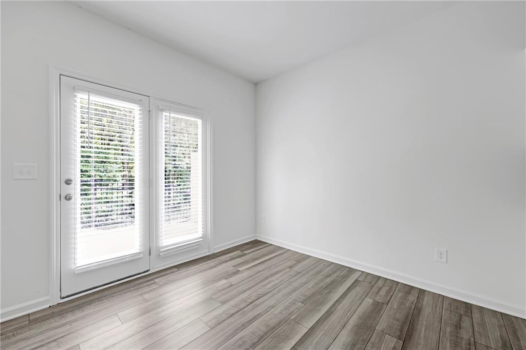 3568 Eagle Court Atlanta, GA 30331 - Photo 8 of 19 an empty room with wooden floor and windows