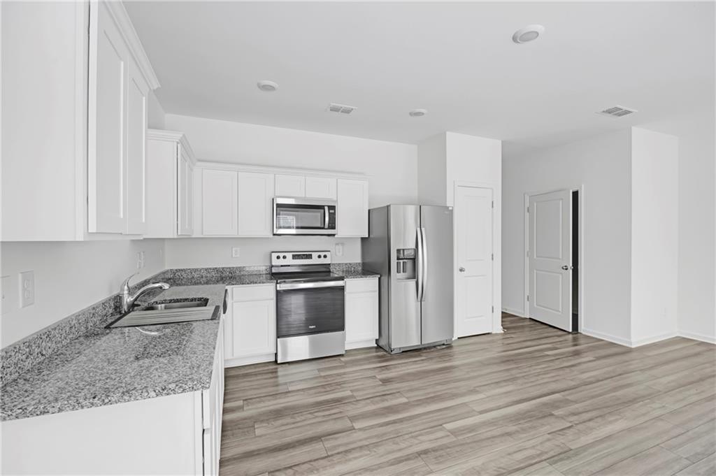 3568 Eagle Court Atlanta, GA 30331 - Photo 9 of 19 a kitchen with stainless steel appliances granite countertop a refrigerator sink and microwave