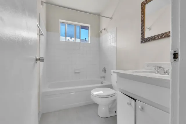 a bathroom with a toilet and a bathtub