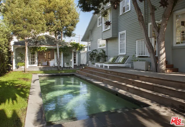 a view of pool with outdoor seating