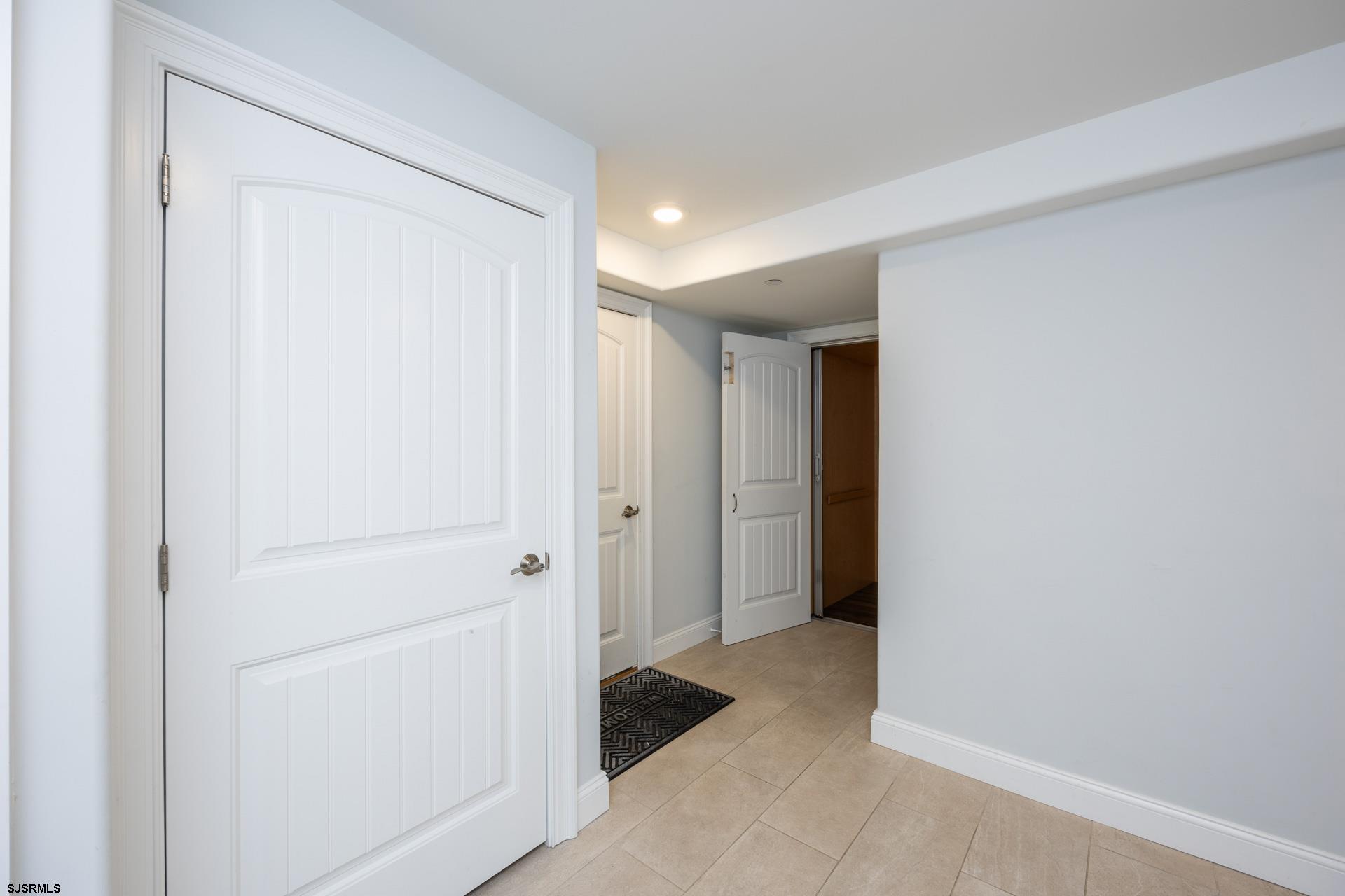 910 Ocean Avenue, Unit C Ocean City, NJ 08226 - Photo 2 of 36 a view of a closet area with en suite bathroom
