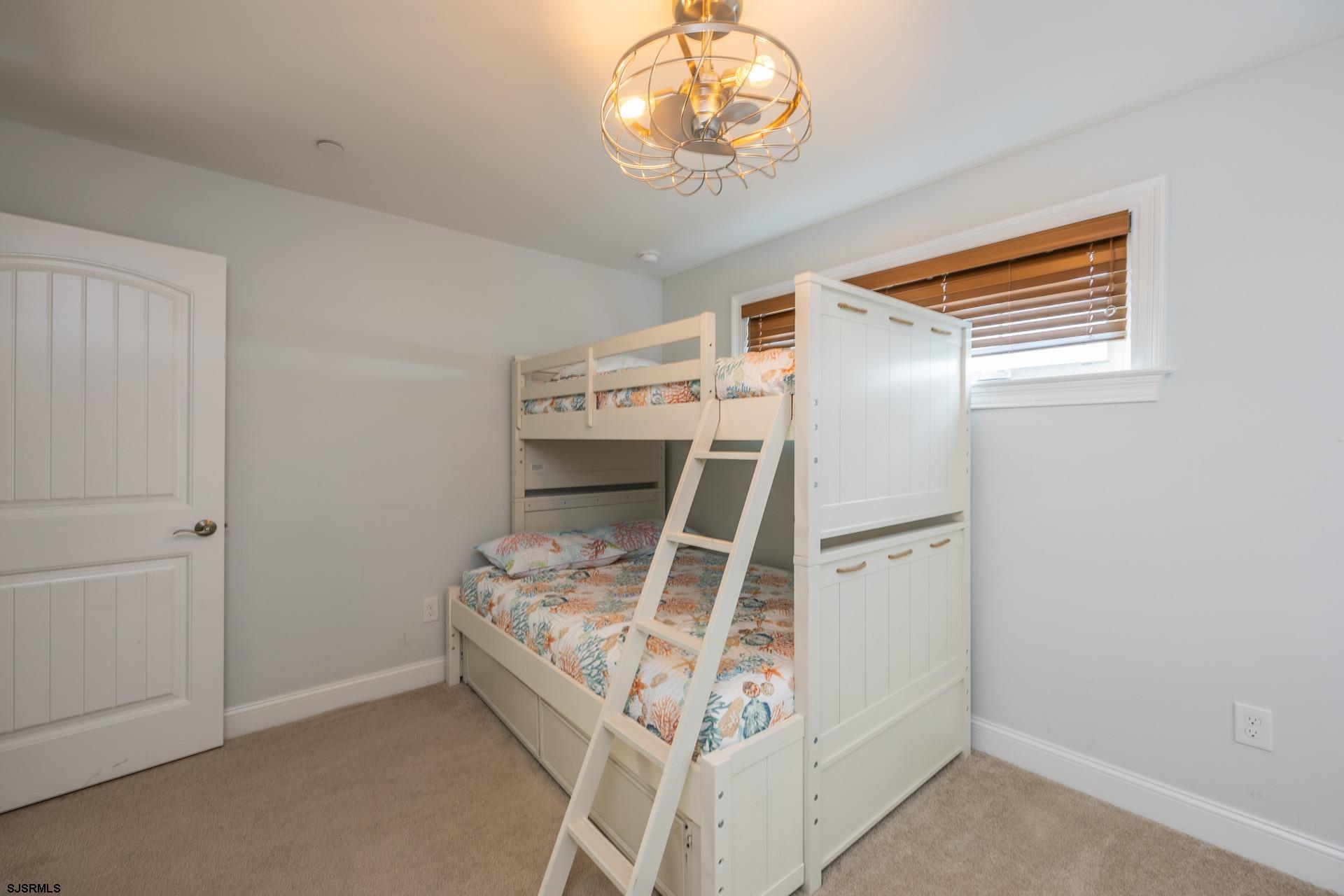 910 Ocean Avenue, Unit C Ocean City, NJ 08226 - Photo 26 of 36 a bed room with a bed and a window