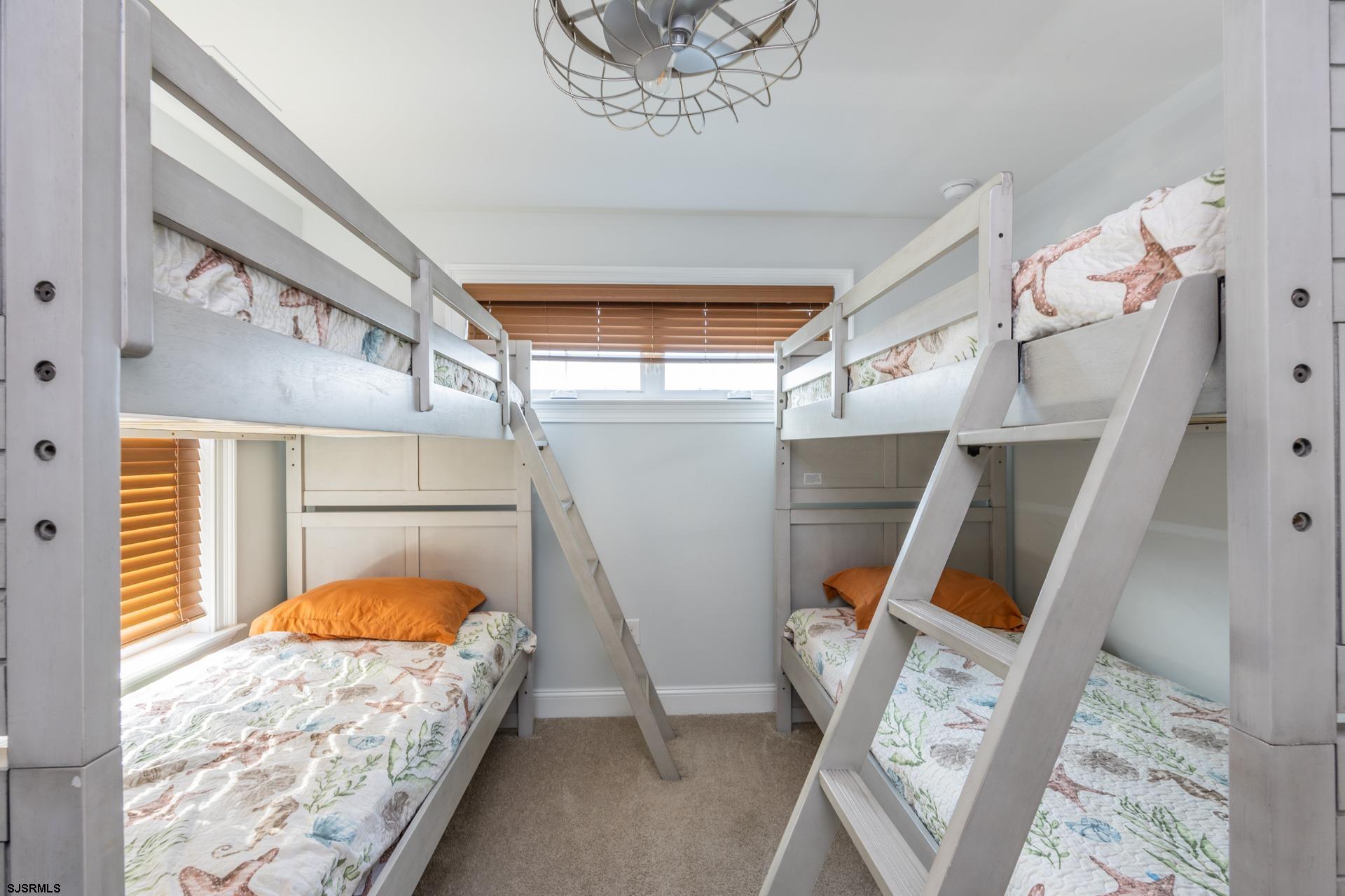 910 Ocean Avenue, Unit C Ocean City, NJ 08226 - Photo 27 of 36 a bed room with a bed