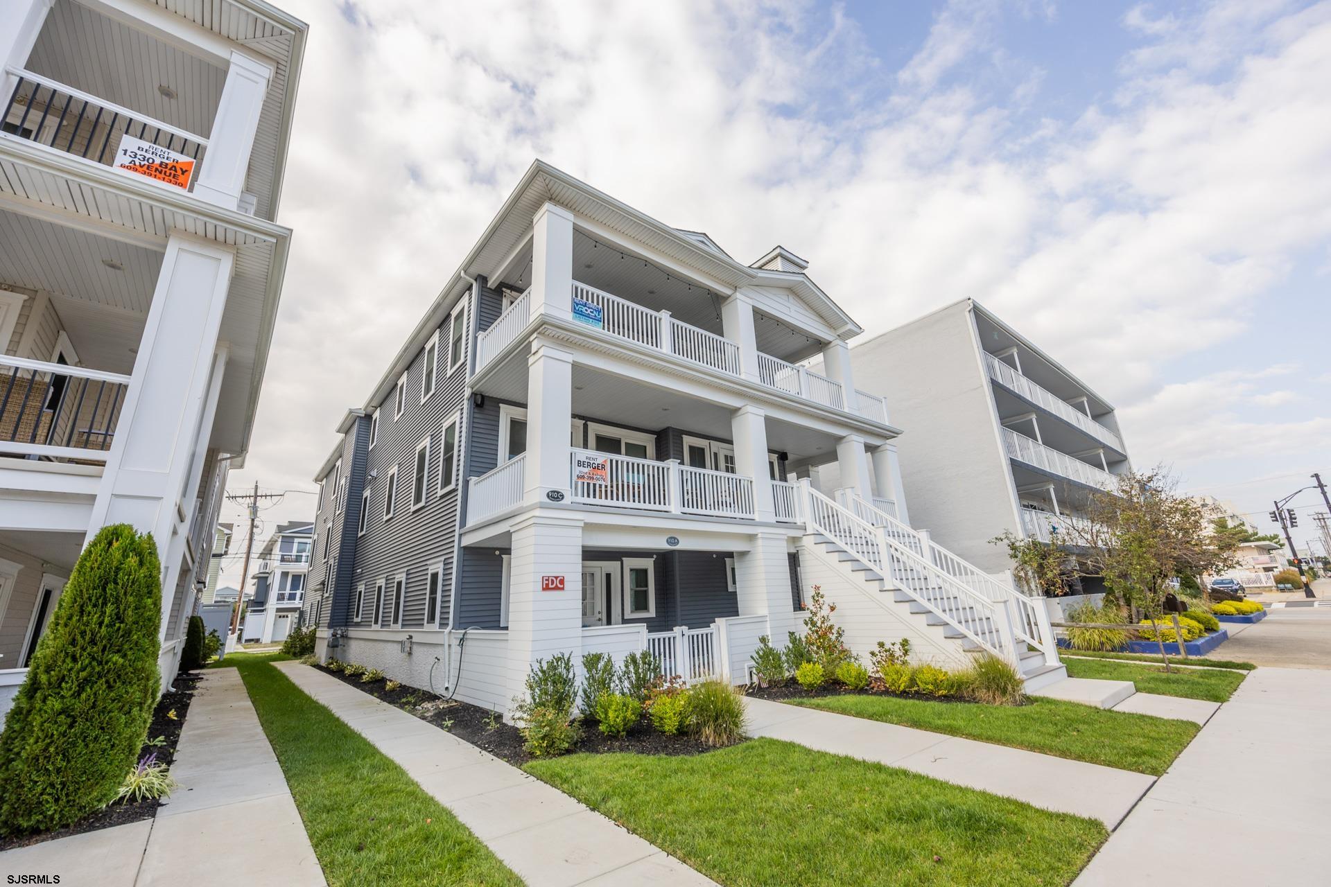 910 Ocean Avenue, Unit C Ocean City, NJ 08226 - Photo 33 of 36 a view of a building with a yard