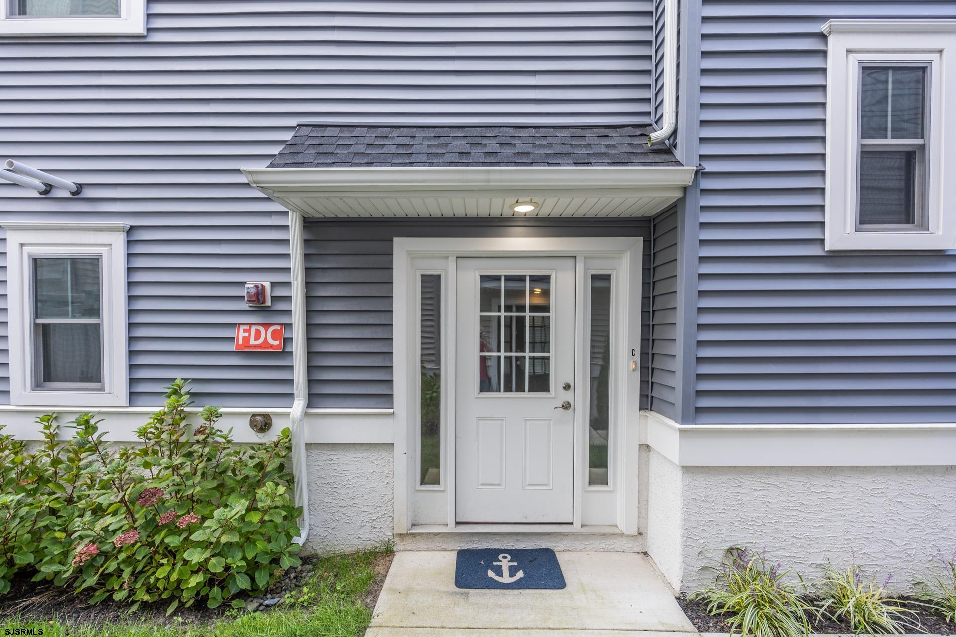 910 Ocean Avenue, Unit C Ocean City, NJ 08226 - Photo 34 of 36 a front view of a house with a garage