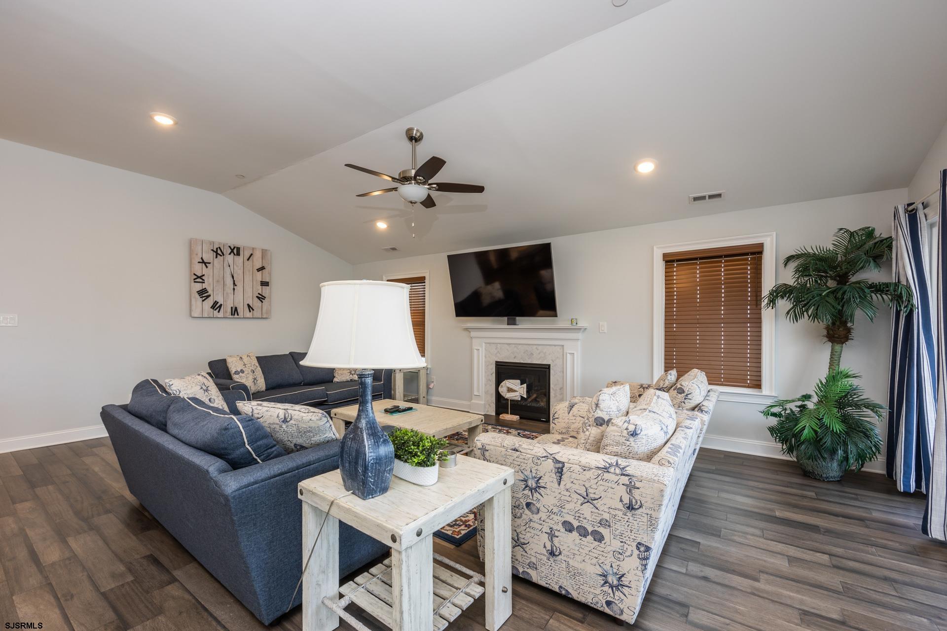 910 Ocean Avenue, Unit C Ocean City, NJ 08226 - Photo 8 of 36 a living room with furniture and a fireplace