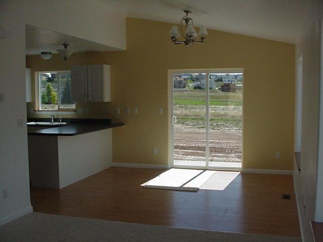 1273 East 18th Street Rifle, CO 81650 - Photo 3 of 4 a view of a livingroom with a chandelier