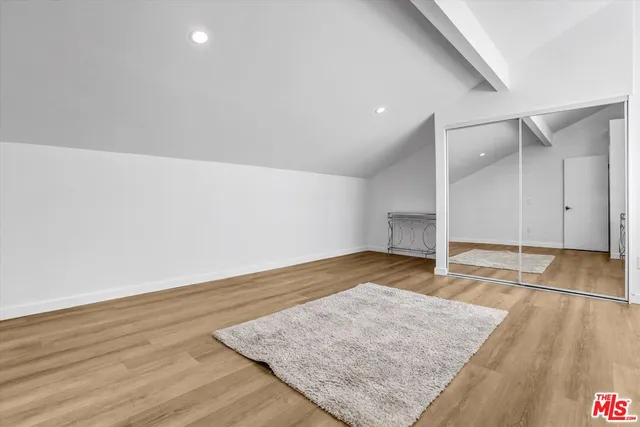 an empty room with wooden floor