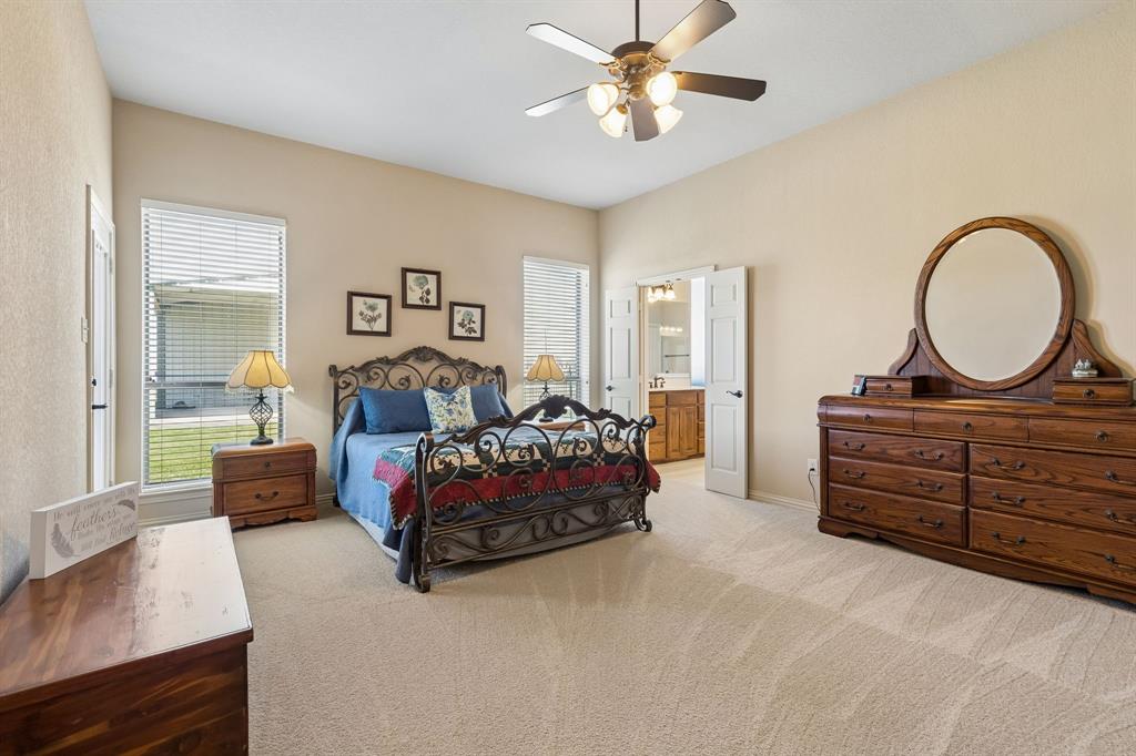 600 Lonesome Trail Haslet, TX 76052 - Photo 17 of 36 a spacious bedroom with a bed and a dresser