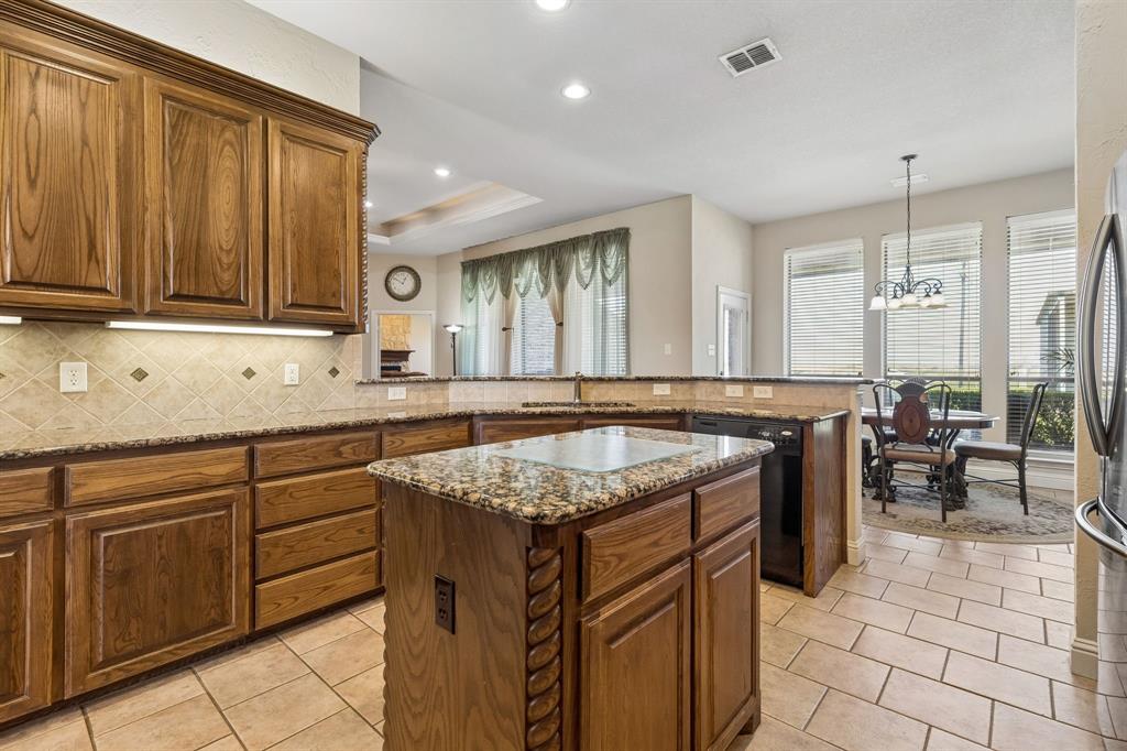 600 Lonesome Trail Haslet, TX 76052 - Photo 2 of 36 a kitchen with a sink and cabinets