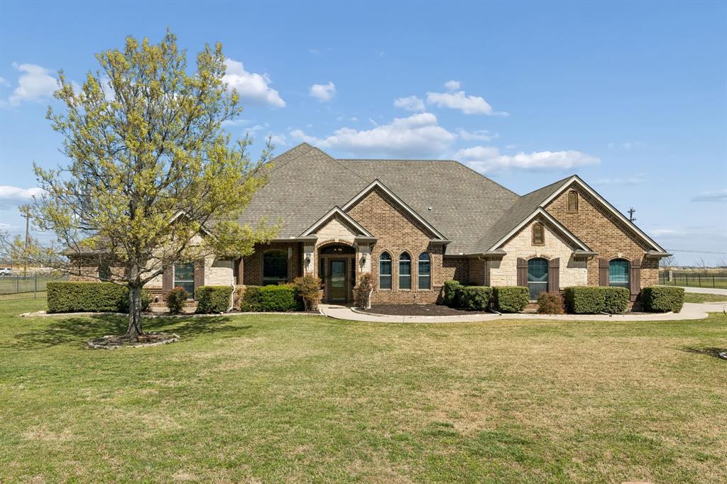 600 Lonesome Trail Haslet, TX 76052 - Photo 5 of 36 a view of a big house with a big yard and large trees