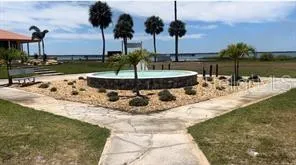 a view of a lake with a big yard