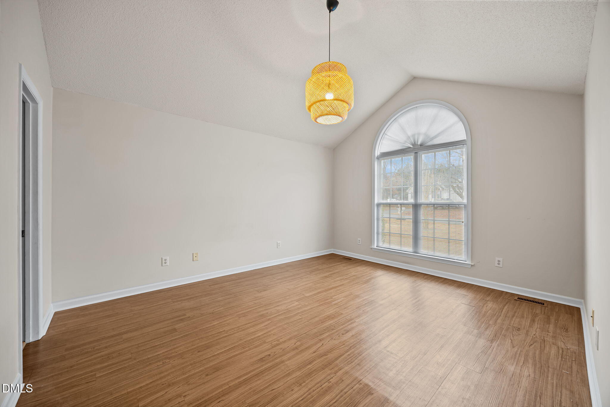71 Rosa Circle Willow Spring, NC 27592 - Photo 13 of 31 an empty room with wooden floor and windows
