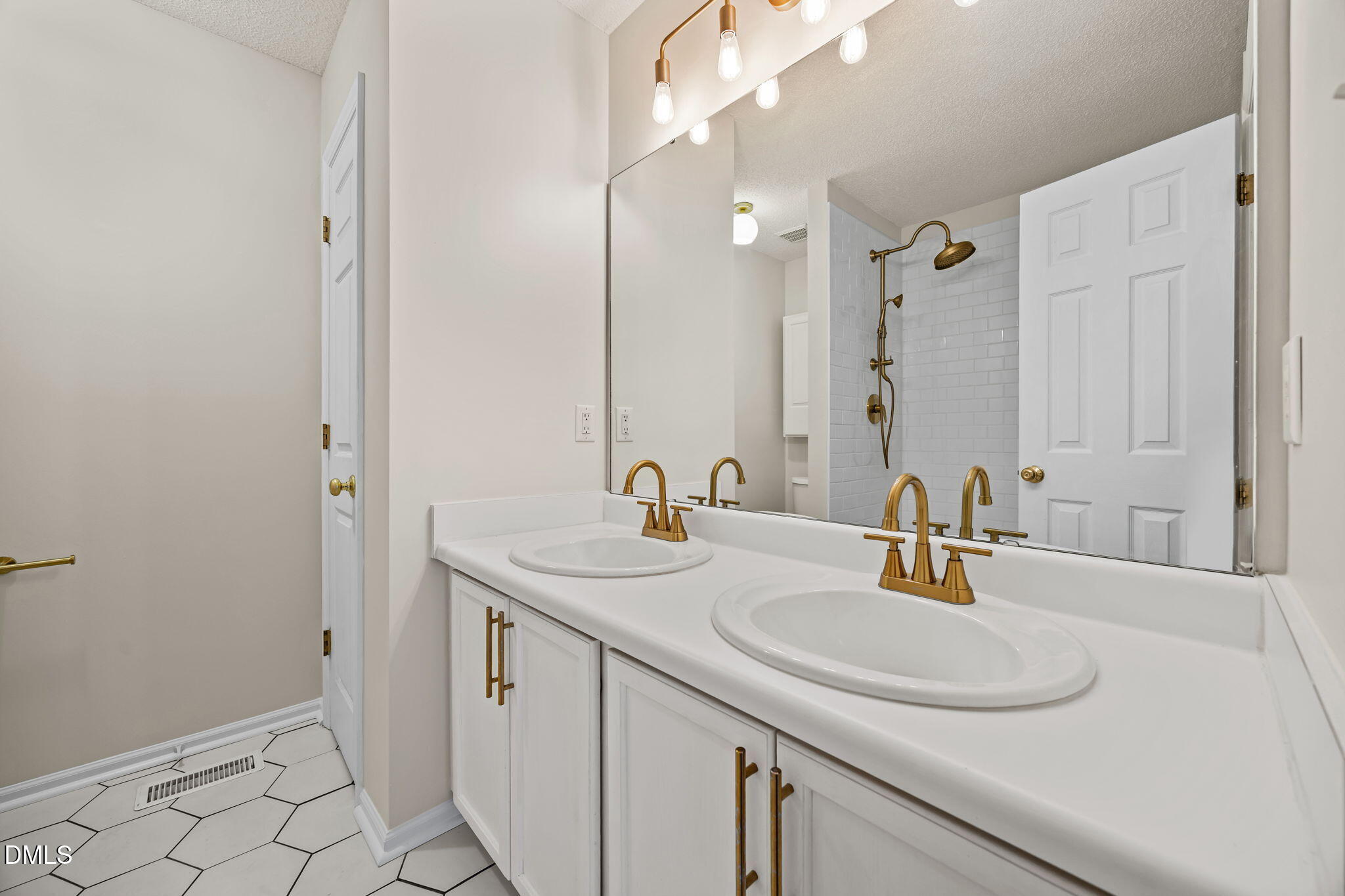 71 Rosa Circle Willow Spring, NC 27592 - Photo 15 of 31 a bathroom with a sink and a mirror