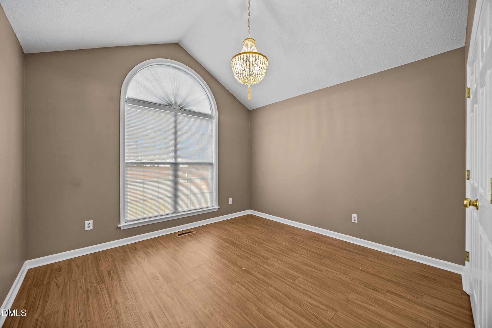 71 Rosa Circle Willow Spring, NC 27592 - Photo 18 of 31 an empty room with wooden floor and window