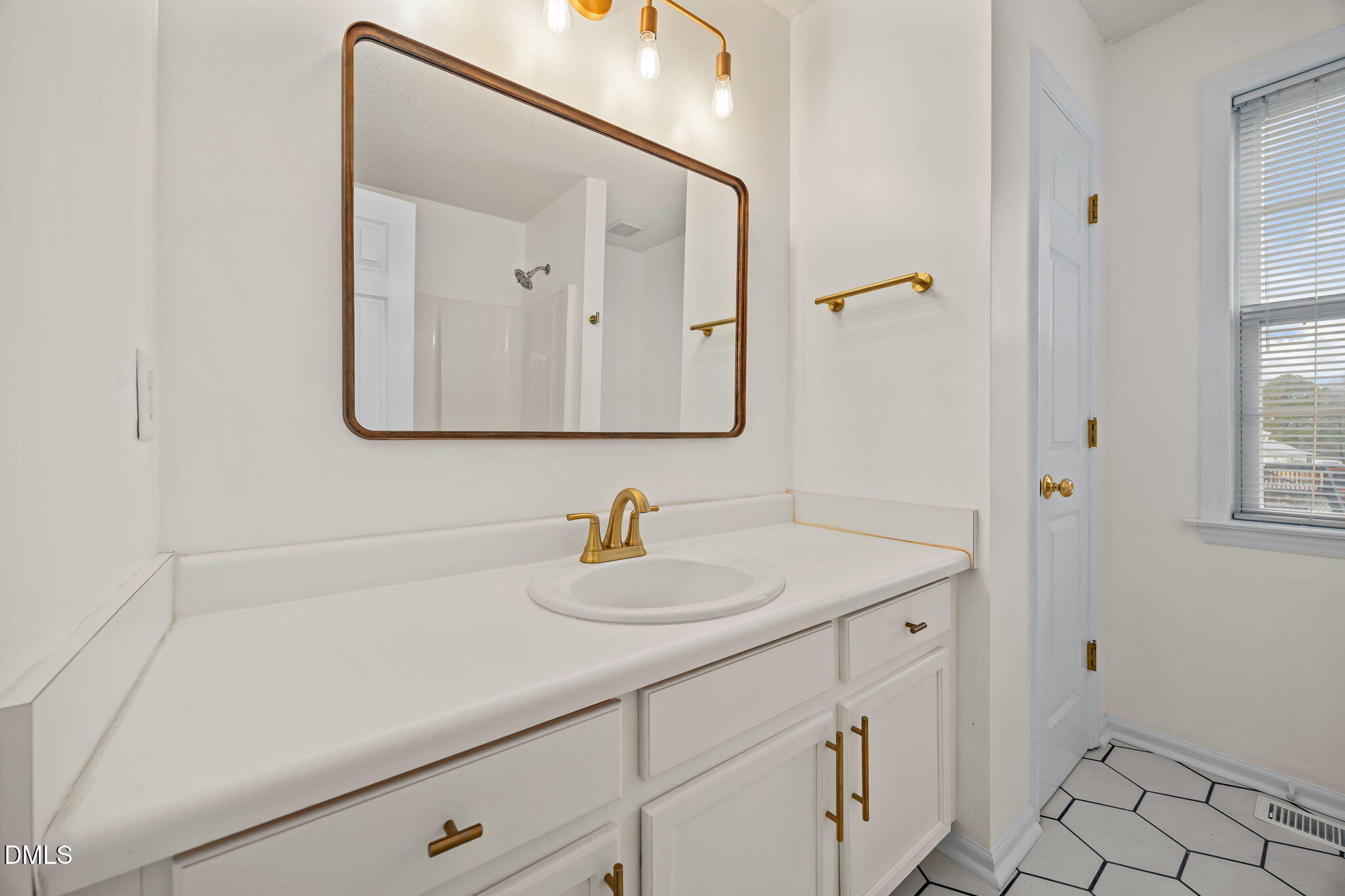71 Rosa Circle Willow Spring, NC 27592 - Photo 20 of 31 a bathroom with a sink and a mirror