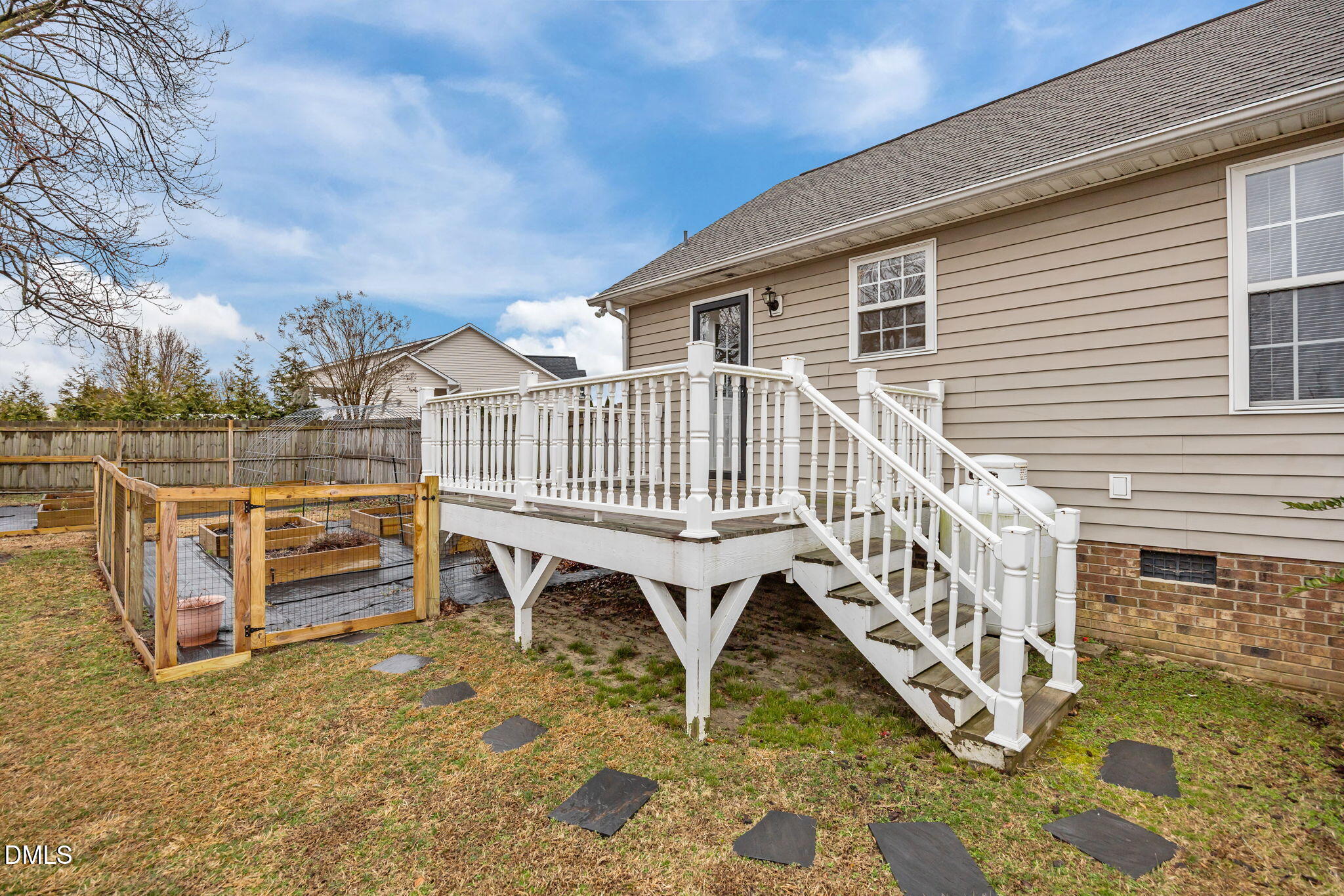 71 Rosa Circle Willow Spring, NC 27592 - Photo 23 of 31 a view of a house with wooden deck and furniture