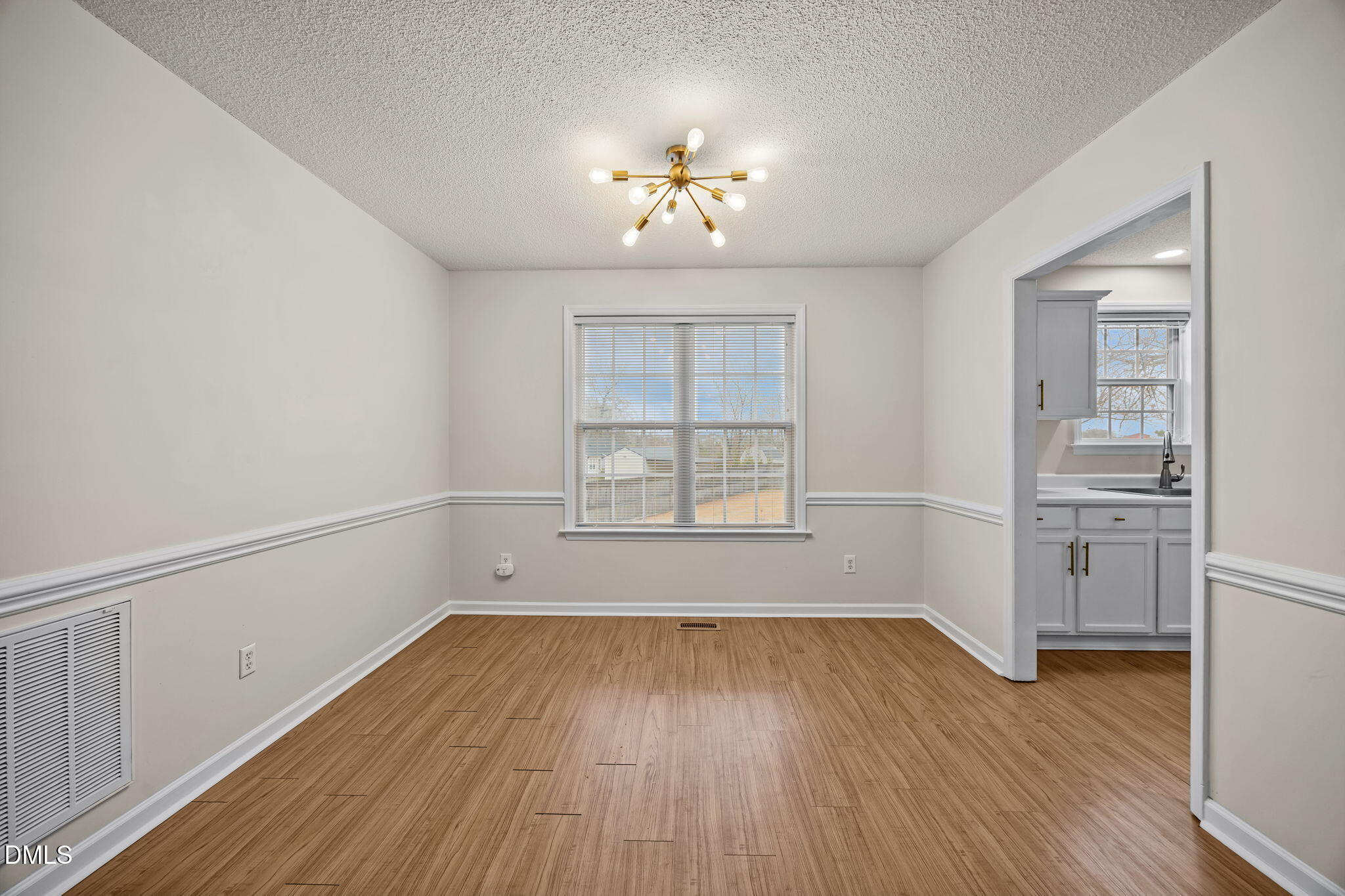 71 Rosa Circle Willow Spring, NC 27592 - Photo 8 of 31 wooden floor in an empty room with a window