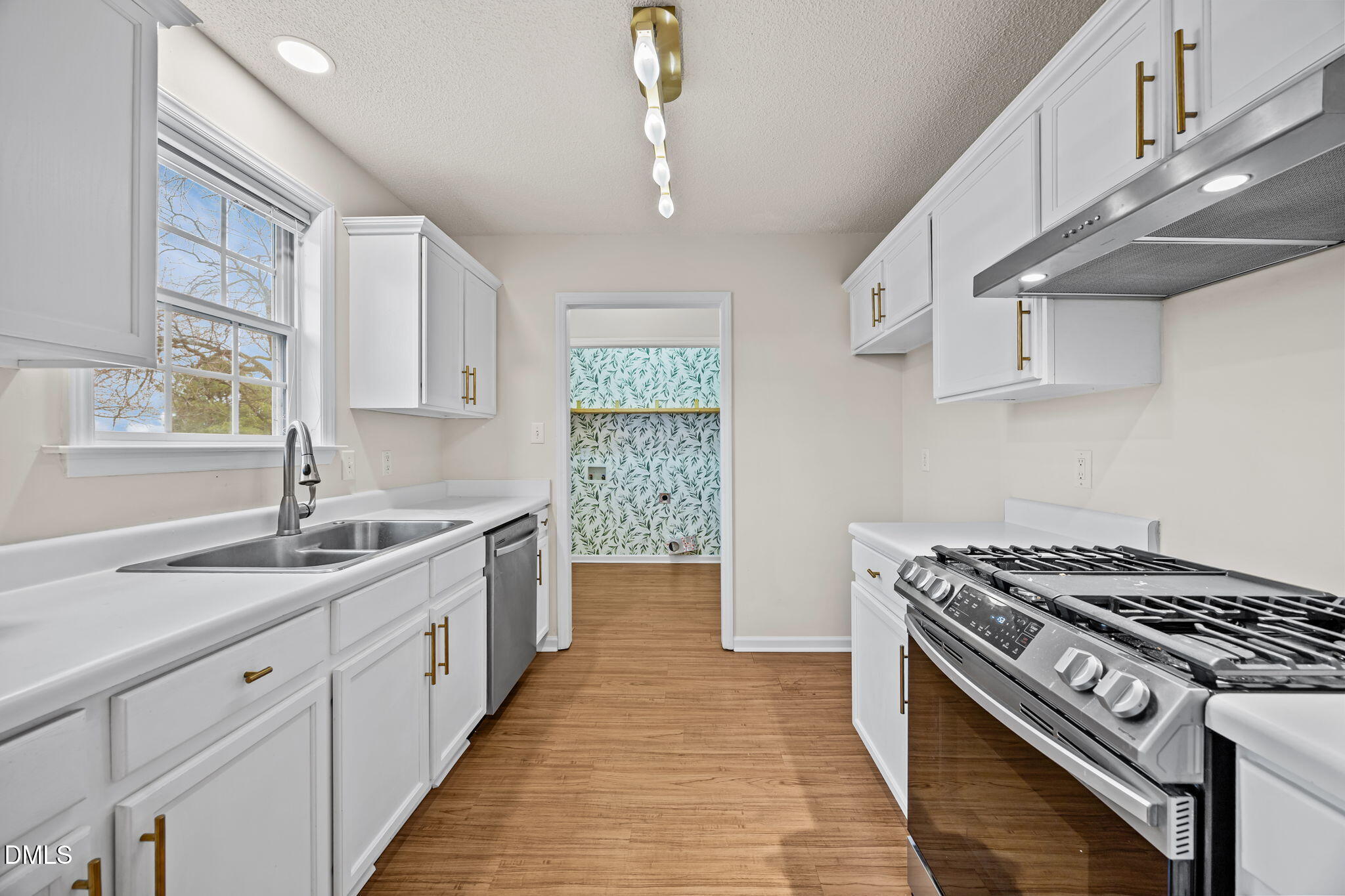 71 Rosa Circle Willow Spring, NC 27592 - Photo 10 of 31 a kitchen with a stove and a sink