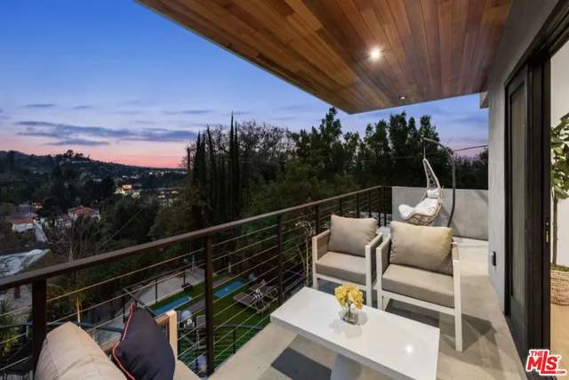 a view of balcony with furniture