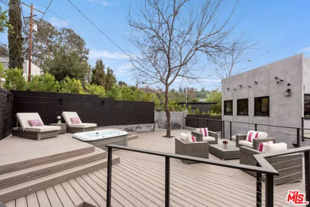a view of a terrace with couches and potted plants
