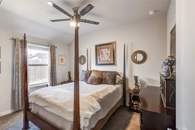 a spacious bathroom with a granite countertop tub sink and mirror
