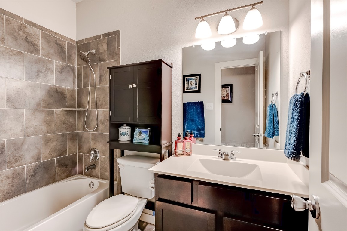 231 Windswept Way Kyle, TX 78640 - Photo 20 of 39 a bathroom with a sink toilet and shower