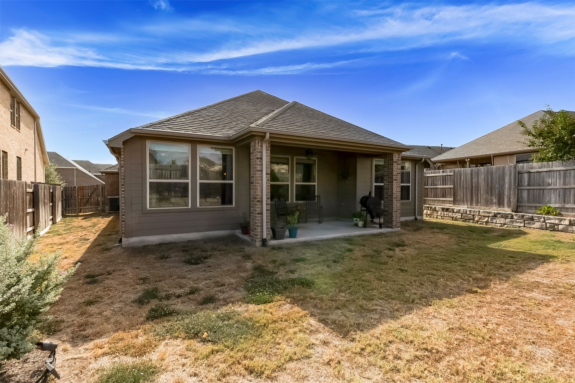 231 Windswept Way Kyle, TX 78640 - Photo 27 of 39 a view of a house with backyard porch and sitting area
