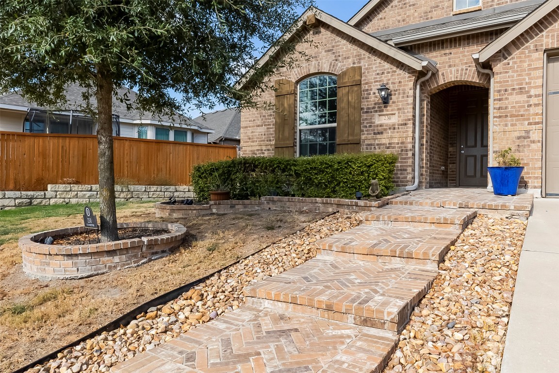 231 Windswept Way Kyle, TX 78640 - Photo 32 of 39 a front view of a house with a yard